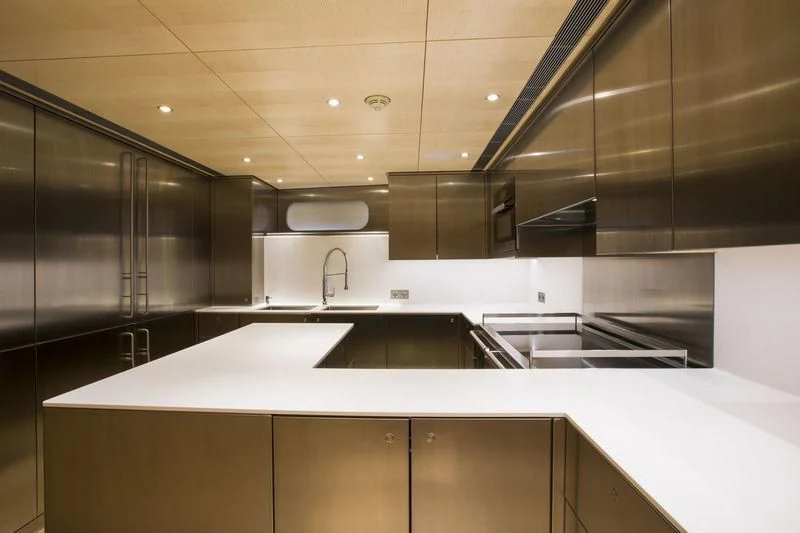 a kitchen with stainless steel appliances aboard UNFURLED Yacht for Sale