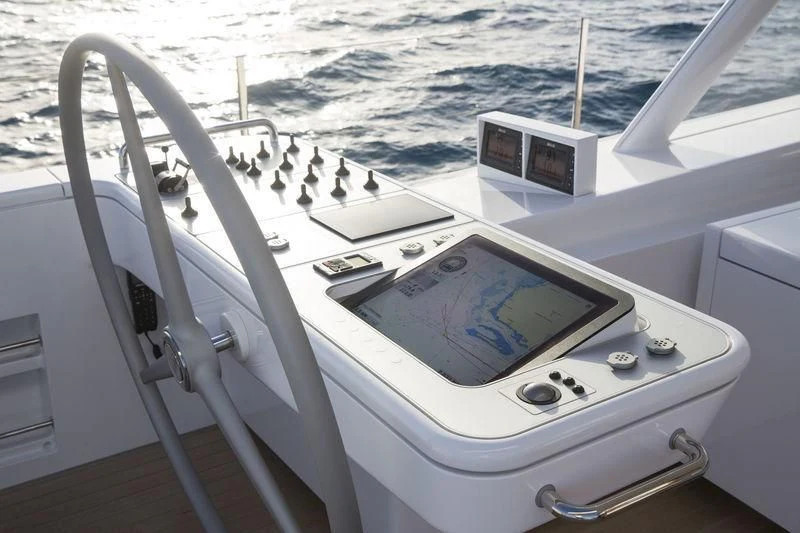 a white boat with a screen aboard UNFURLED Yacht for Sale