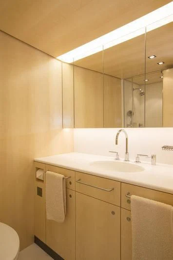 a bathroom with a large mirror aboard UNFURLED Yacht for Sale