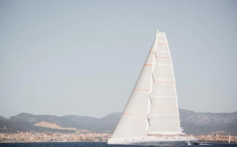 a sailboat on a beach aboard UNFURLED Yacht for Sale