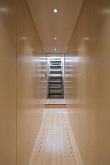 a hallway with a glass door aboard UNFURLED Yacht for Sale