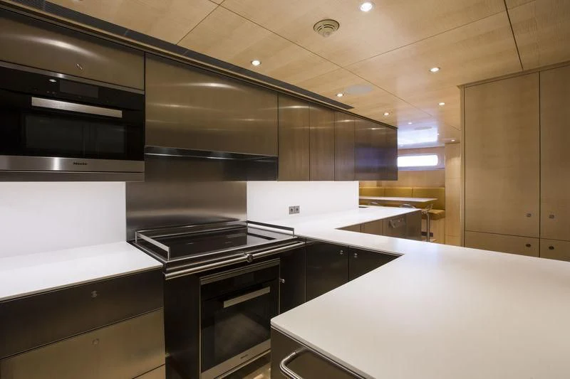 a kitchen with stainless steel appliances aboard UNFURLED Yacht for Sale