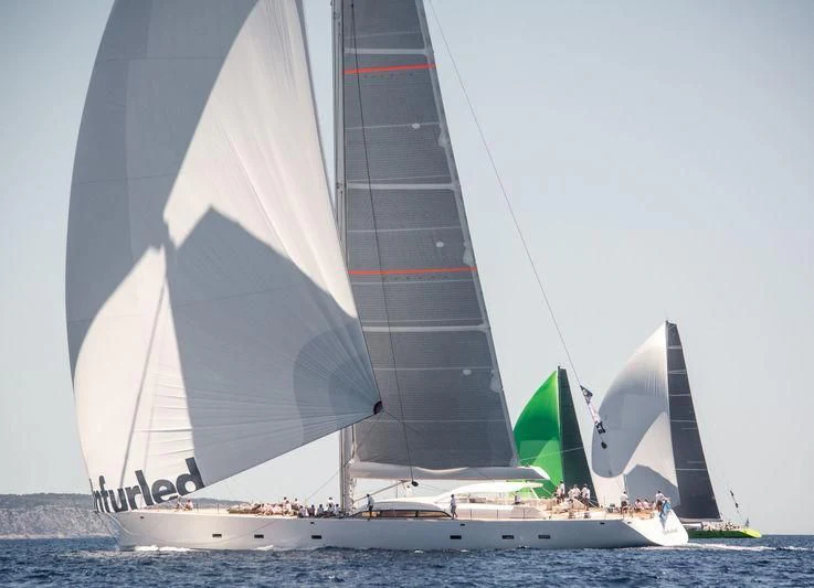 a sailboat with a sail aboard UNFURLED Yacht for Sale