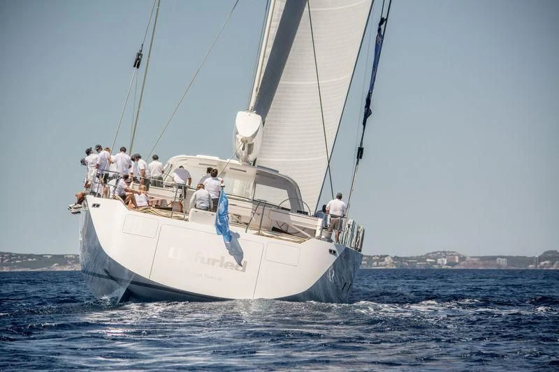 a group of people on a sailboat aboard UNFURLED Yacht for Sale