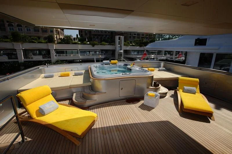 a large modern looking kitchen with a large table and chairs aboard FALCO MOSCATA Yacht for Sale