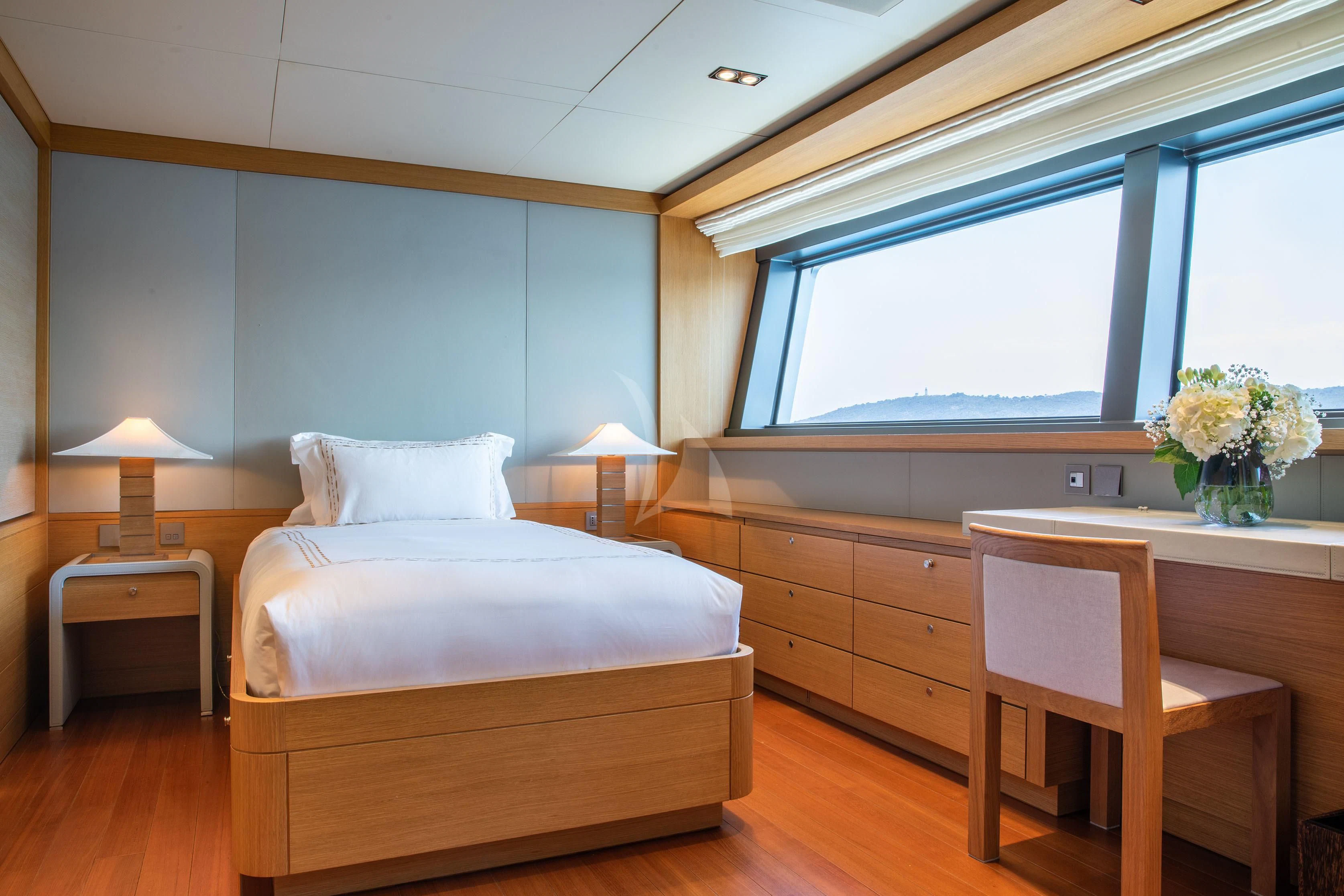 a bedroom with a bed and a desk aboard FALCO MOSCATA Yacht for Sale