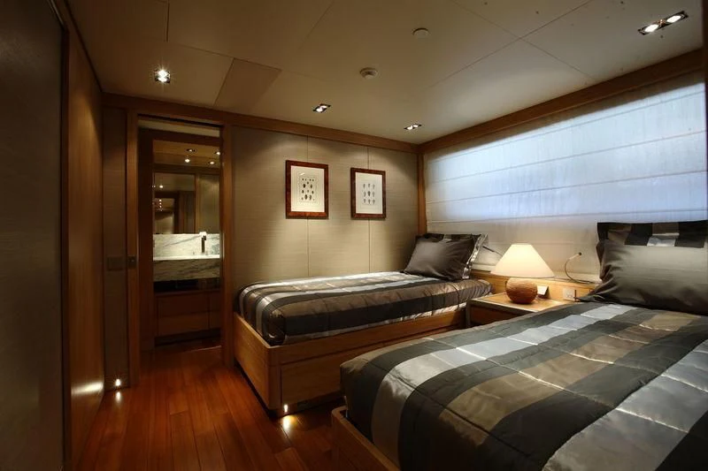 a bedroom with a bed and a desk aboard FALCO MOSCATA Yacht for Sale