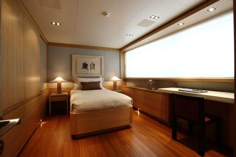 a bedroom with a bed and a desk aboard FALCO MOSCATA Yacht for Sale