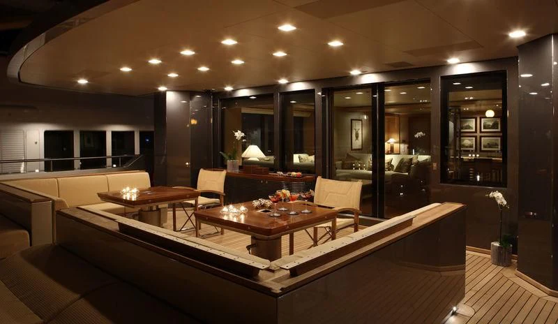 a room with a table and chairs aboard FALCO MOSCATA Yacht for Sale