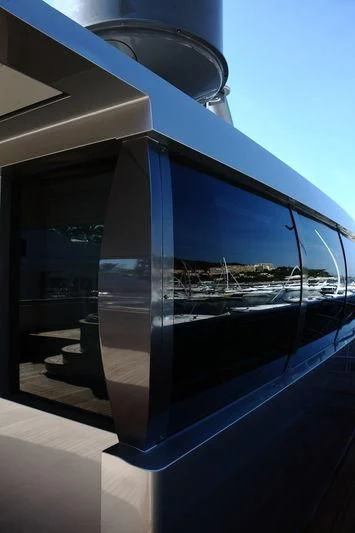 a glass door with a view of a city aboard FALCO MOSCATA Yacht for Sale