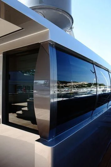 a glass door with a view of a city aboard FALCO MOSCATA Yacht for Sale