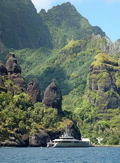a boat in the water by a cliff aboard FALCO MOSCATA Yacht for Sale