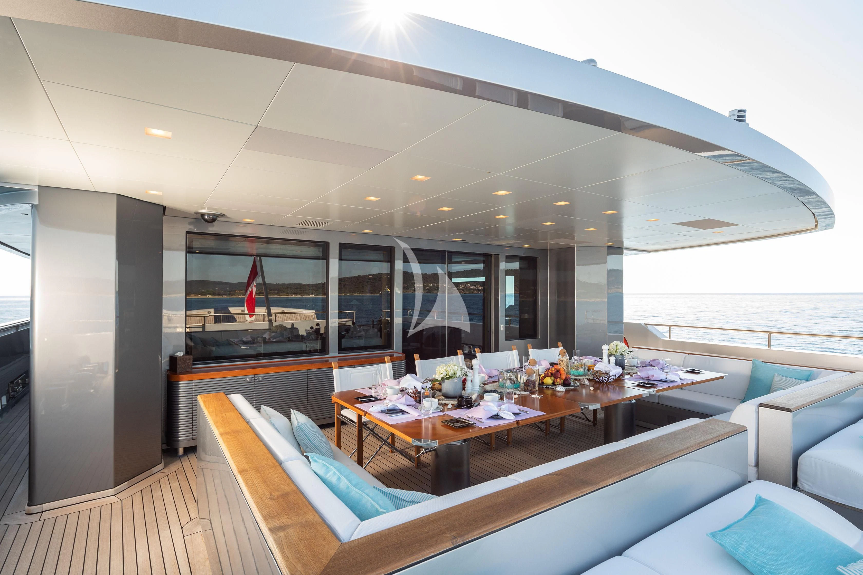a room with a table and chairs aboard FALCO MOSCATA Yacht for Sale