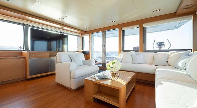 a living room with a couch and a coffee table aboard FALCO MOSCATA Yacht for Sale