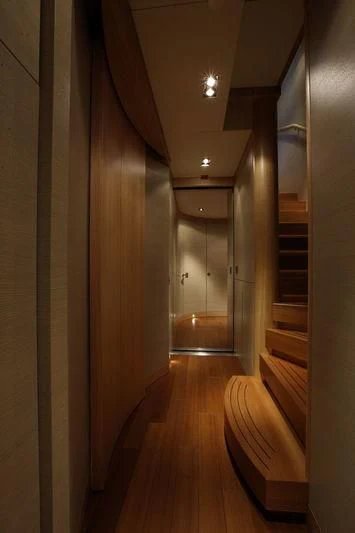 a hallway with a wood floor and white walls aboard FALCO MOSCATA Yacht for Sale