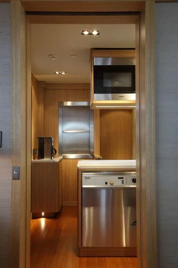 a kitchen with a microwave oven aboard FALCO MOSCATA Yacht for Sale