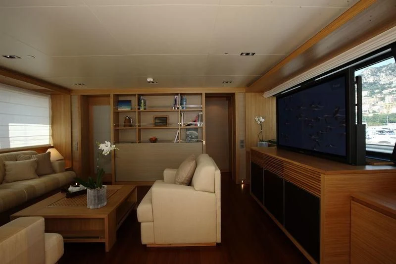 a living room with a large screen aboard FALCO MOSCATA Yacht for Sale