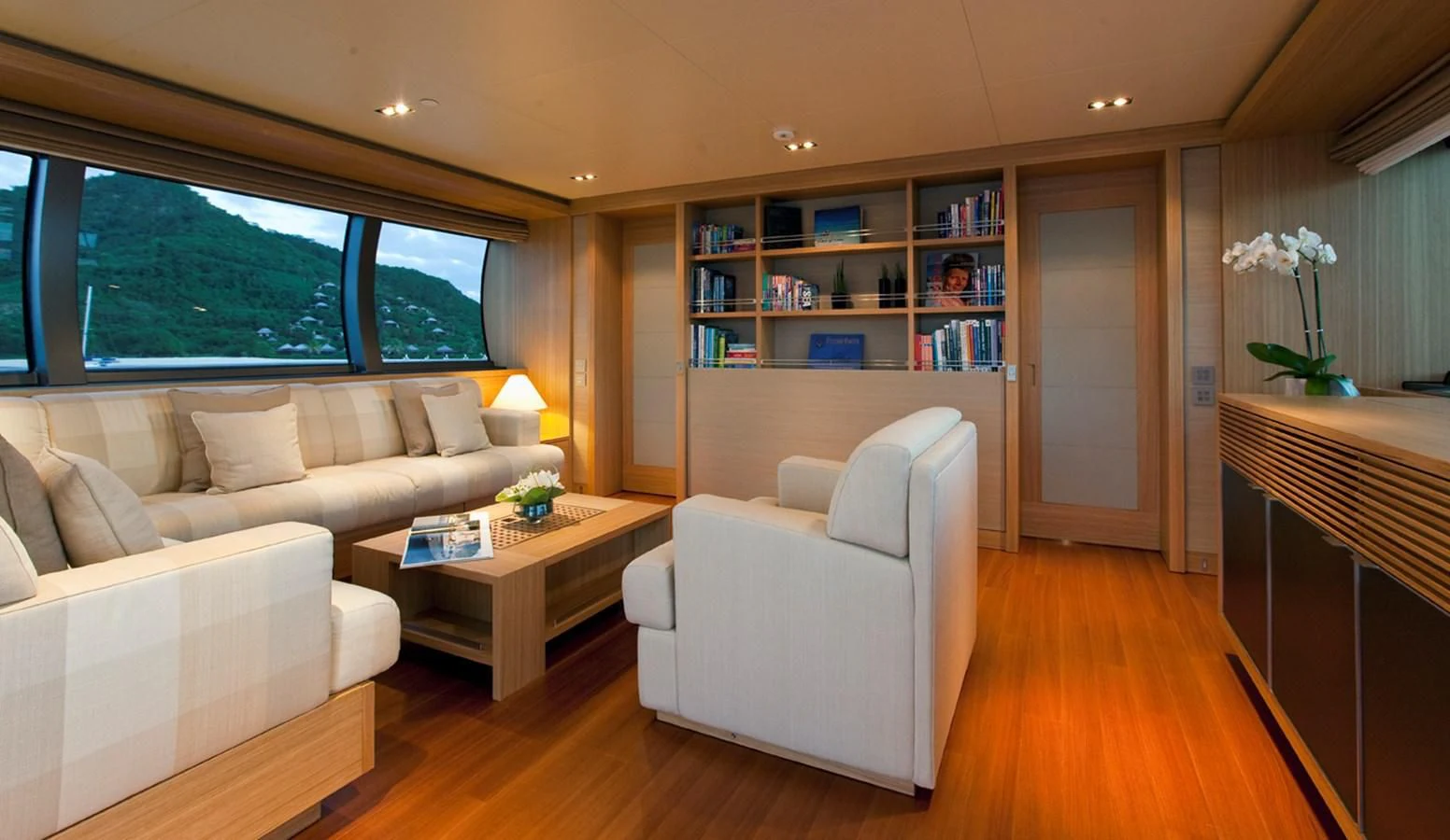 a living room with a couch and a table aboard FALCO MOSCATA Yacht for Sale
