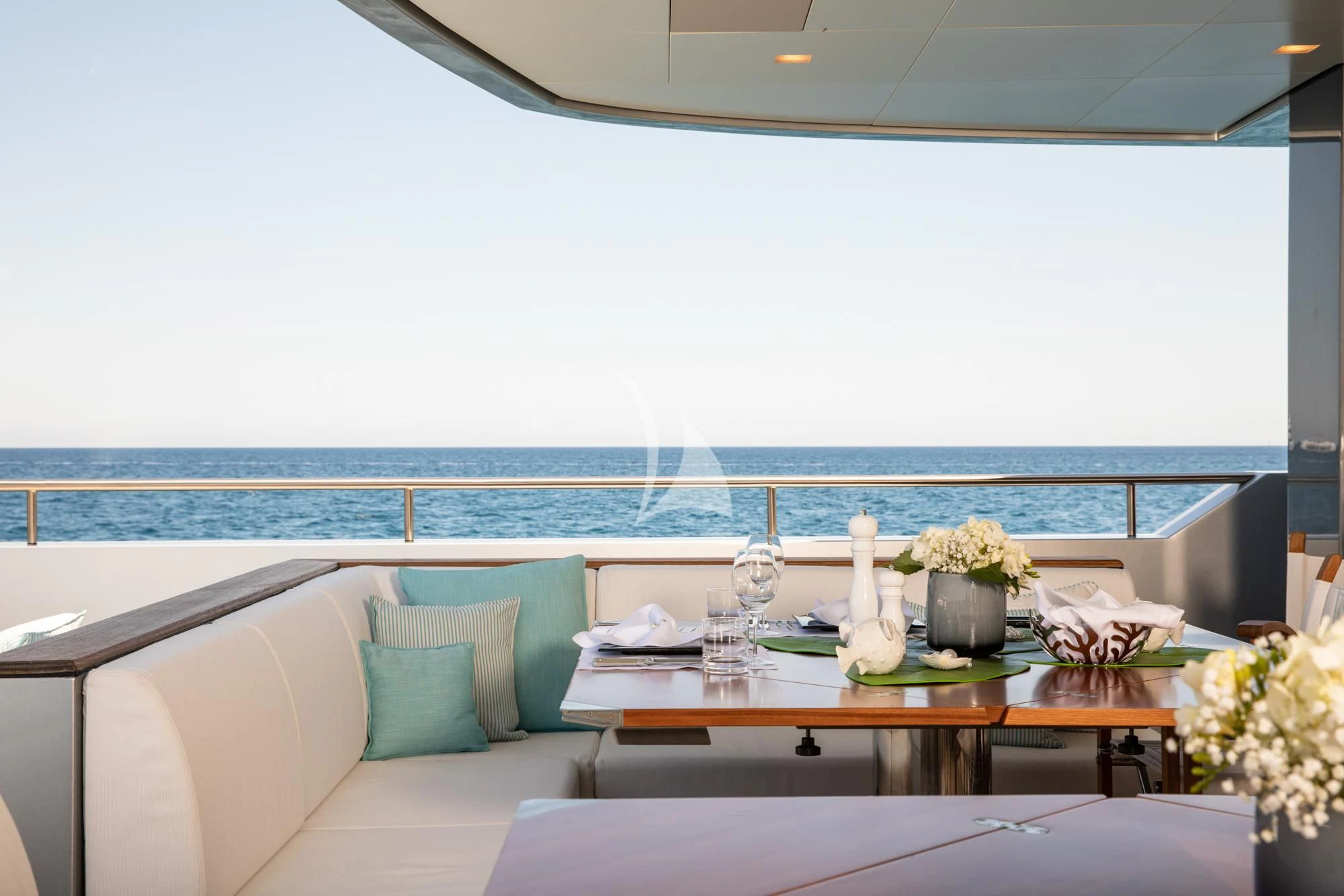 a table with a vase of flowers on it aboard FALCO MOSCATA Yacht for Sale