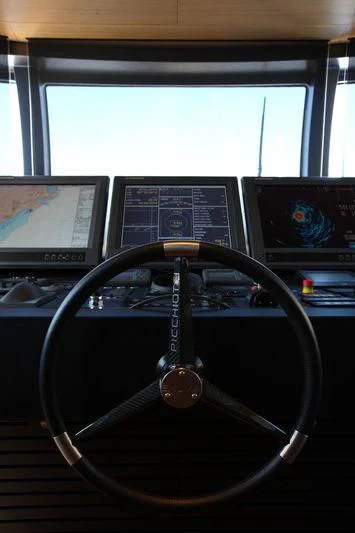 a steering wheel and a control panel aboard FALCO MOSCATA Yacht for Sale