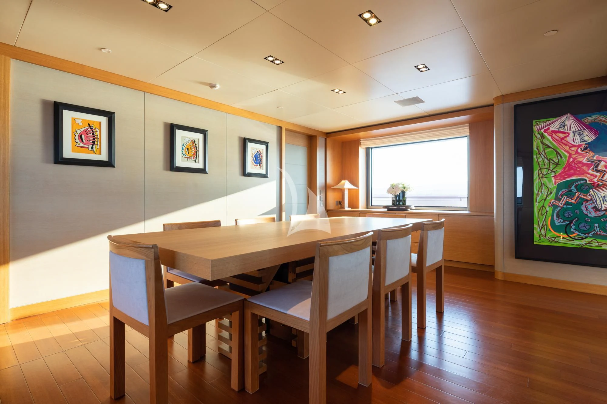 a room with a table and chairs aboard FALCO MOSCATA Yacht for Sale