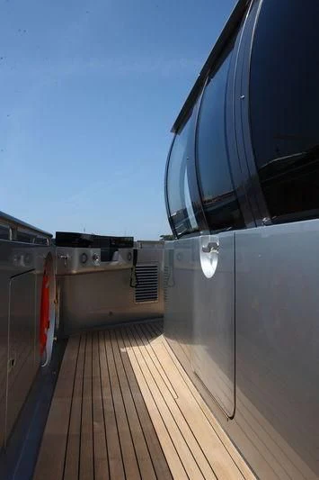 a car on a wooden deck aboard FALCO MOSCATA Yacht for Sale