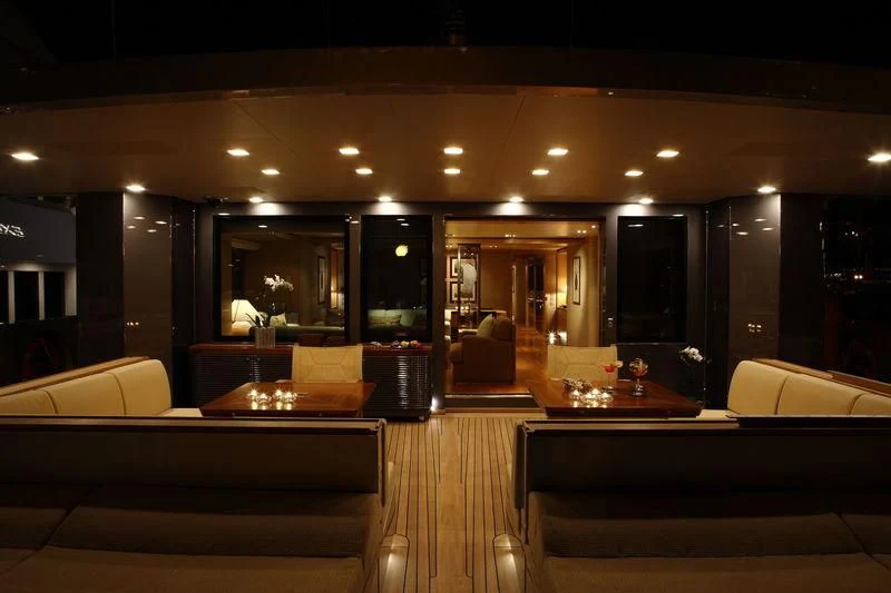 a large room with couches and a table aboard FALCO MOSCATA Yacht for Sale