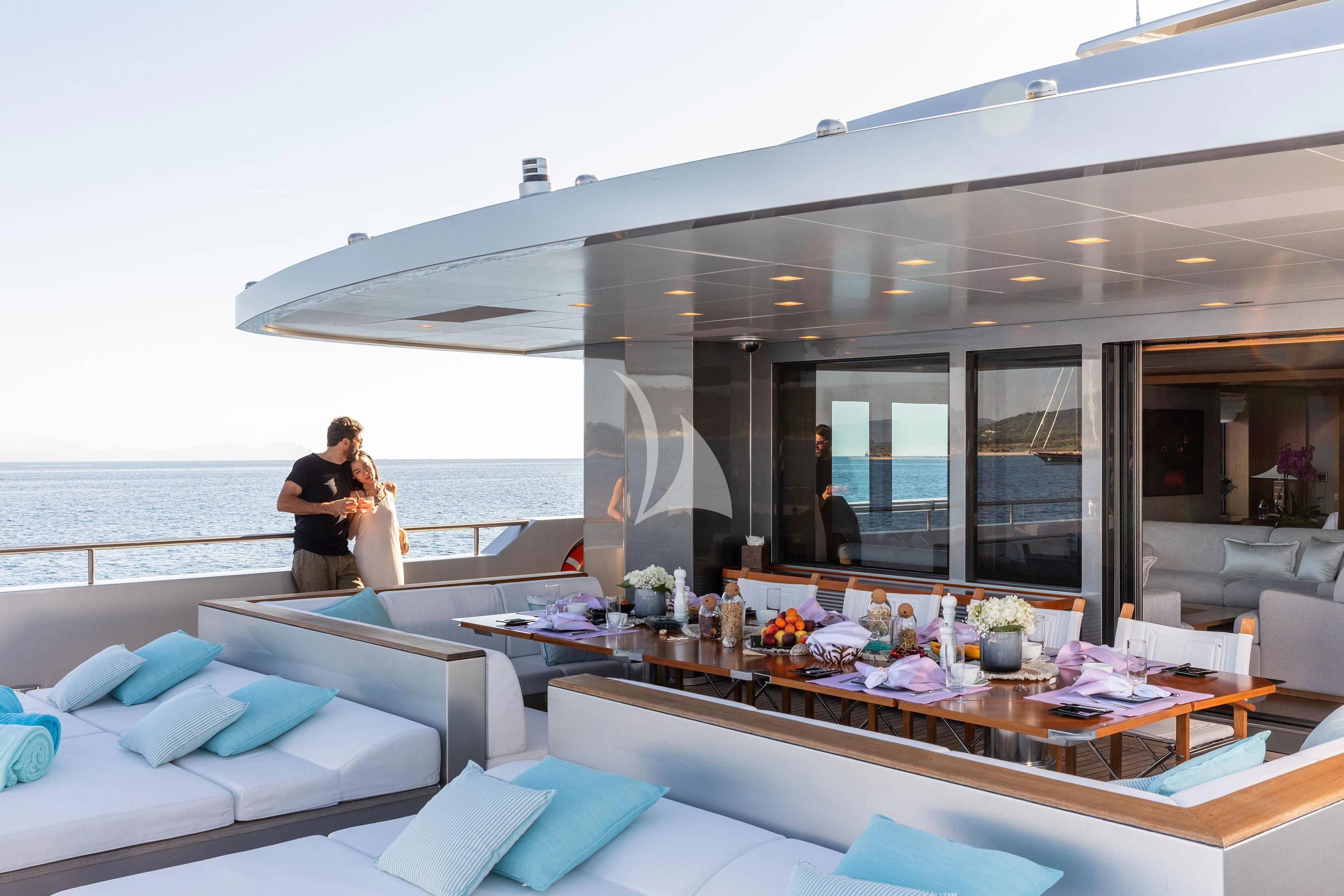 a couple kissing on a balcony aboard FALCO MOSCATA Yacht for Sale