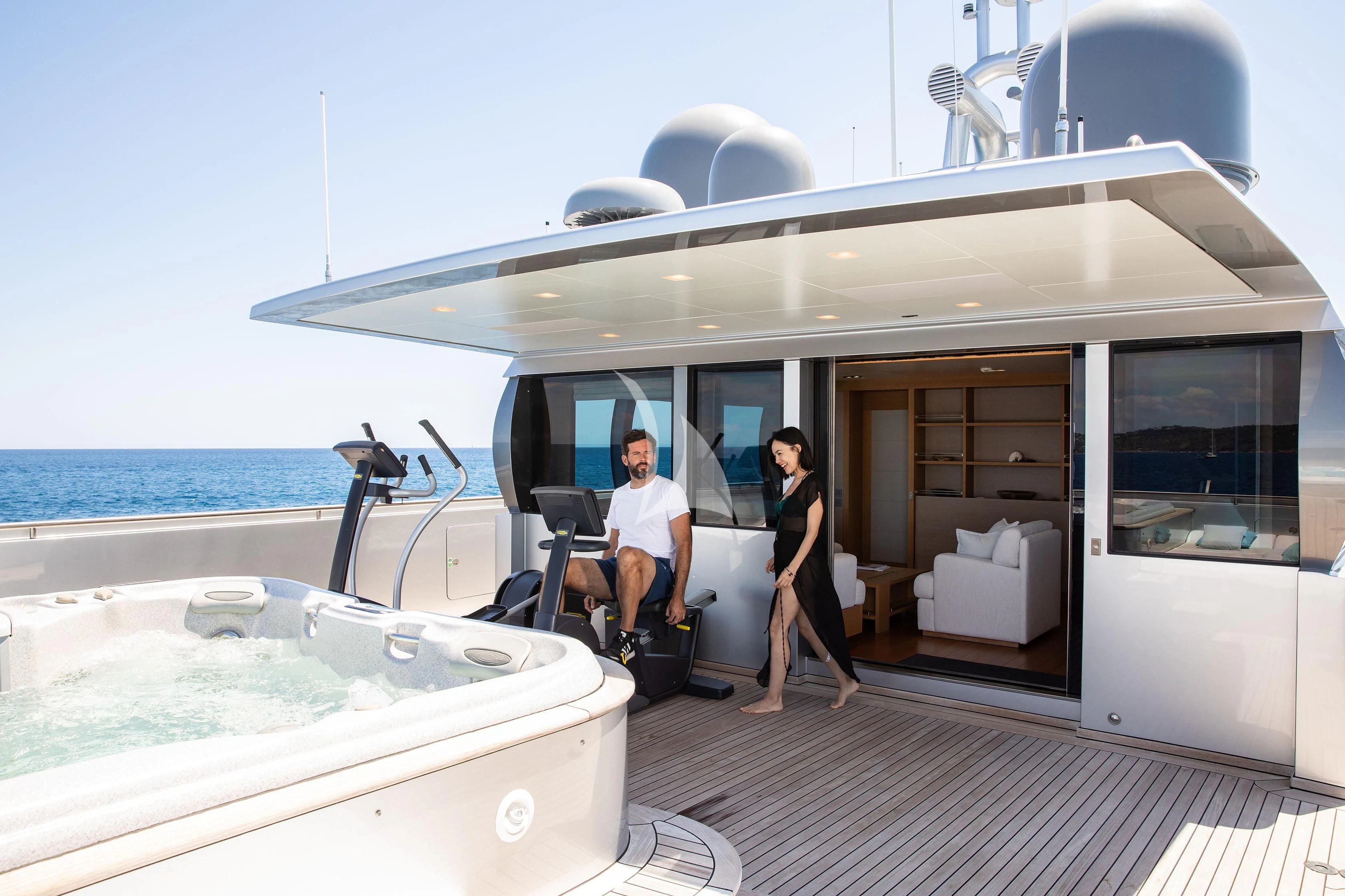 a man and woman sitting in a boat on the water aboard FALCO MOSCATA Yacht for Sale