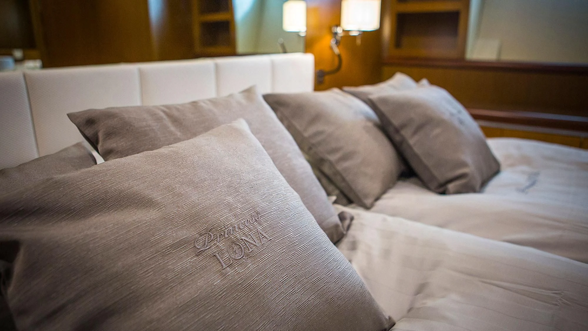 a bed with pillows aboard PRINCESS LONA Yacht for Sale