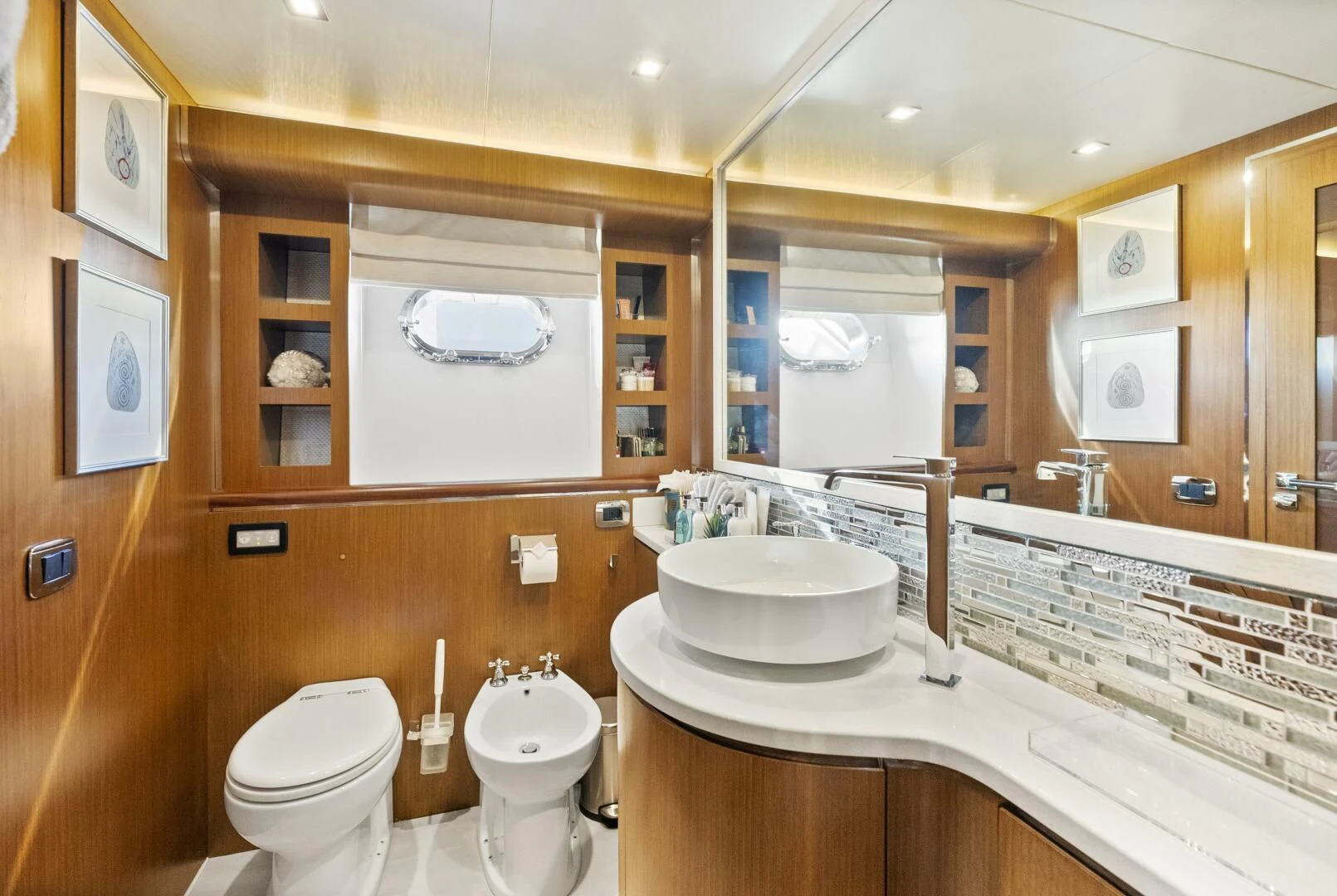 a bathroom with a sink toilet and a mirror aboard PRINCESS LONA Yacht for Sale