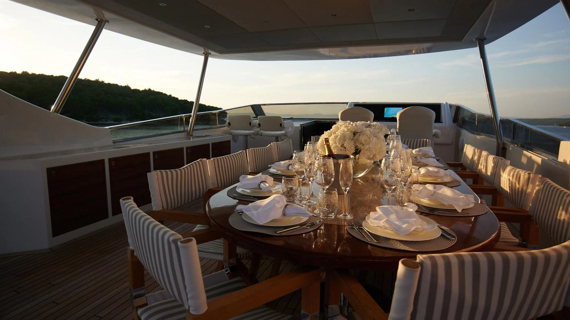 a table set with plates and glasses aboard PRINCESS LONA Yacht for Sale