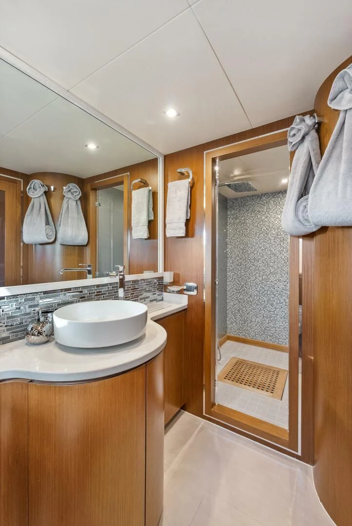 a bathroom with a sink and a shower aboard PRINCESS LONA Yacht for Sale