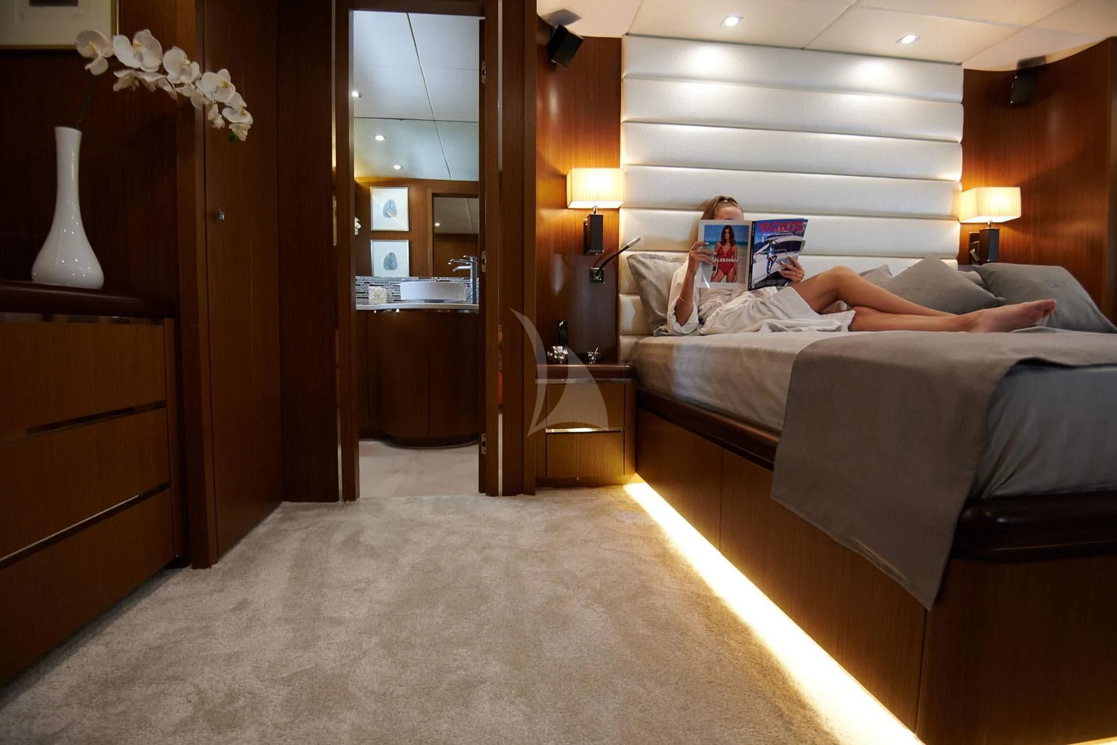 a person lying in a bed aboard PRINCESS LONA Yacht for Sale