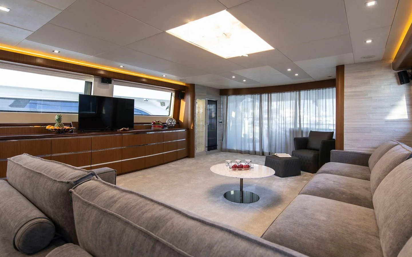 a living room with a couch and a tv aboard PRINCESS LONA Yacht for Sale