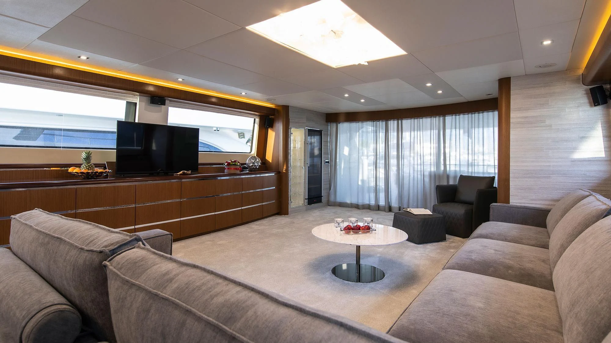 a living room with a large window aboard PRINCESS LONA Yacht for Sale
