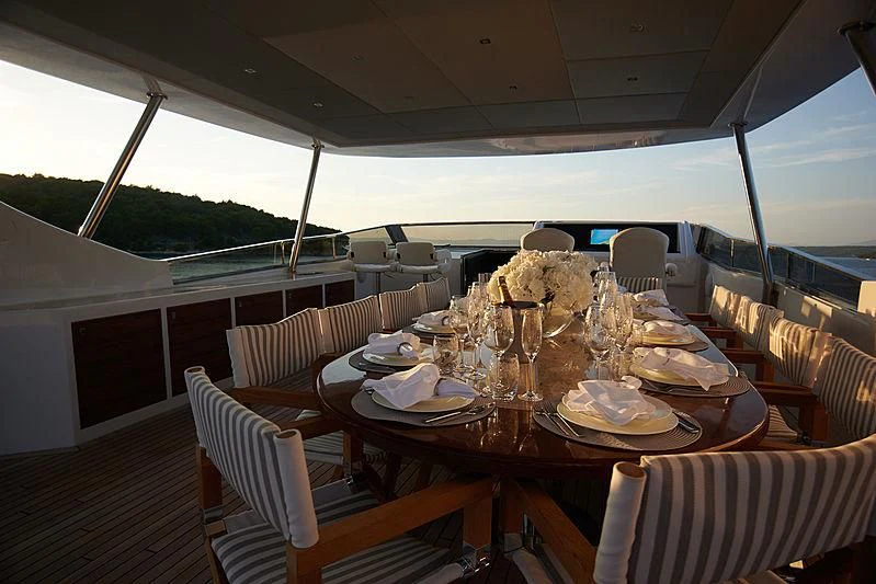 a table set for a meal aboard PRINCESS LONA Yacht for Sale