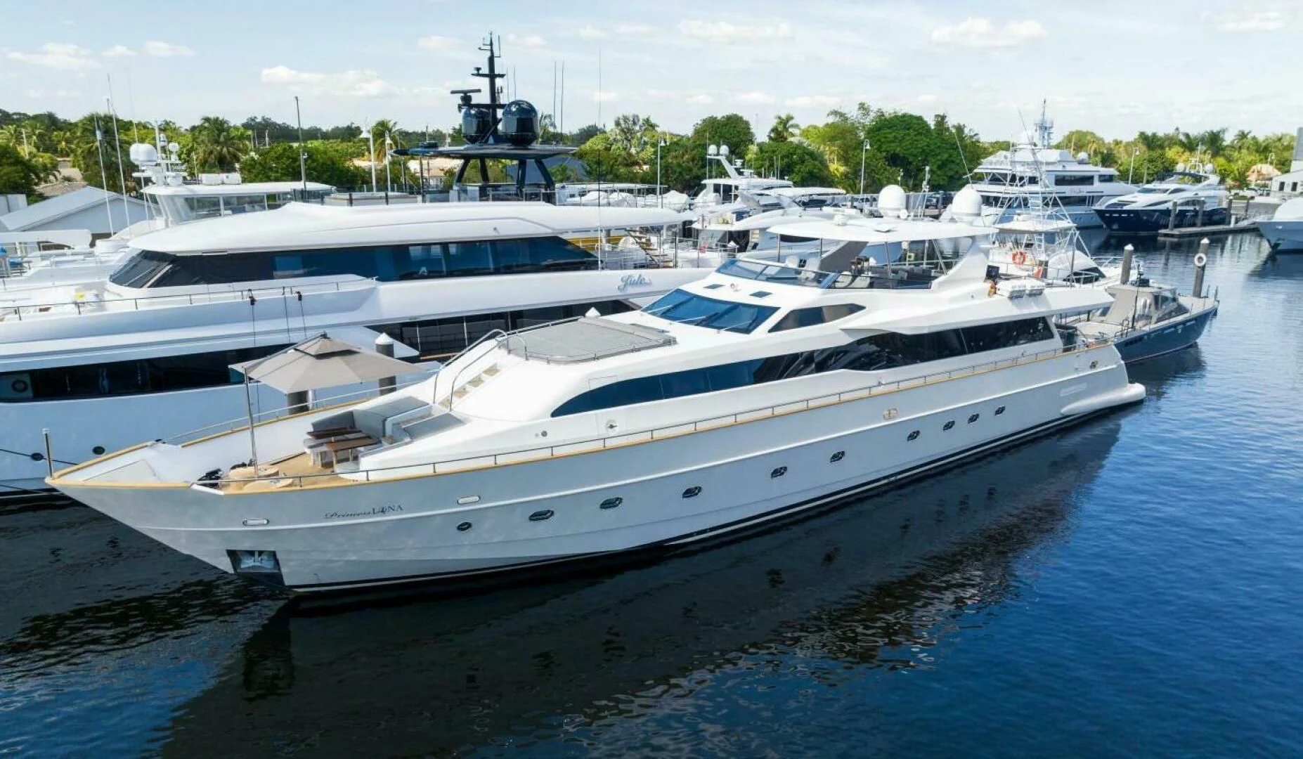 a large white boat in a harbor aboard PRINCESS LONA Yacht for Sale