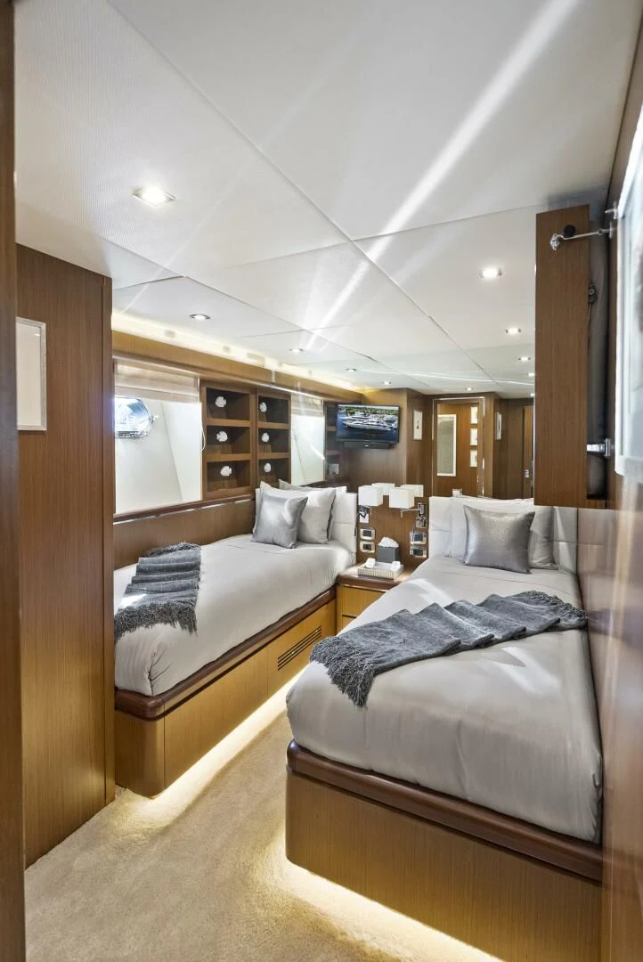 a room with two beds aboard PRINCESS LONA Yacht for Sale