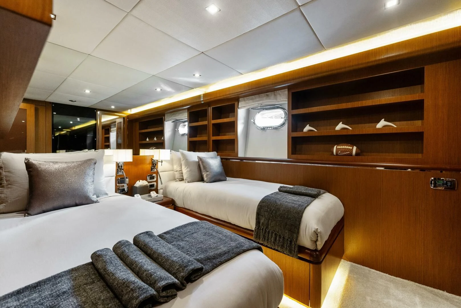 a room with a bed and a chair aboard PRINCESS LONA Yacht for Sale