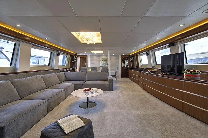a living room with a couch and a tv aboard PRINCESS LONA Yacht for Sale