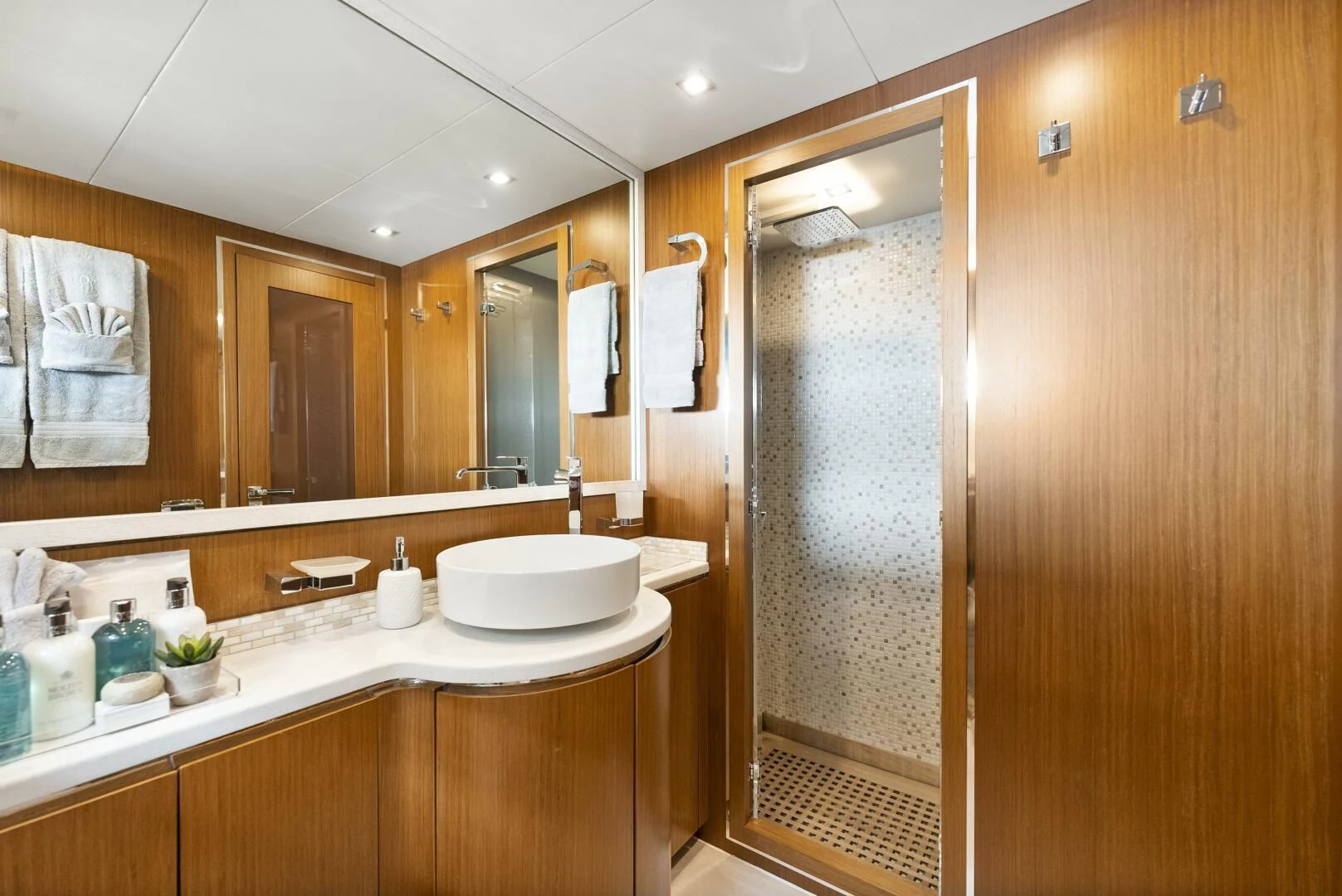 a bathroom with a large mirror aboard PRINCESS LONA Yacht for Sale