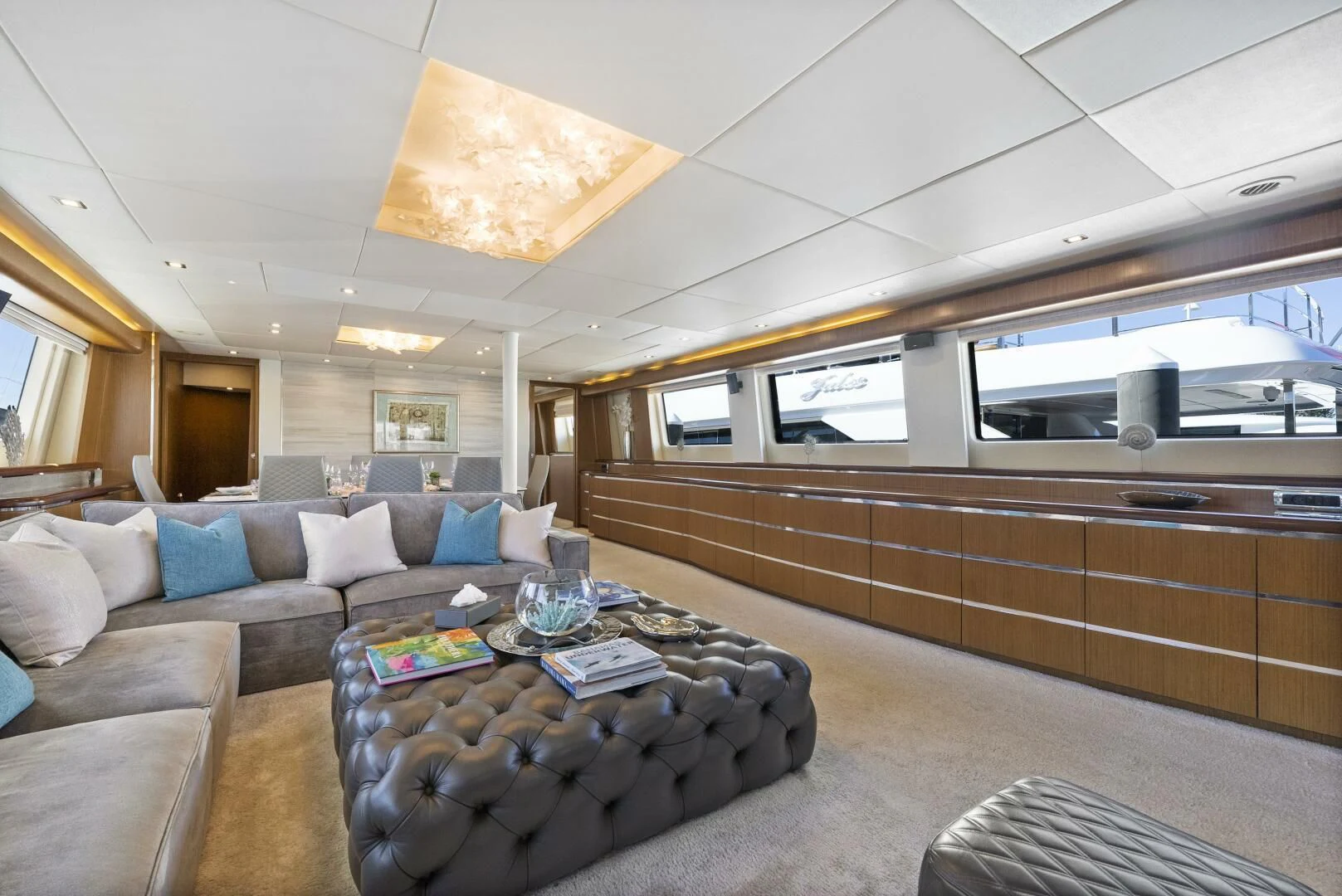 a living room with a couch and a coffee table aboard PRINCESS LONA Yacht for Sale