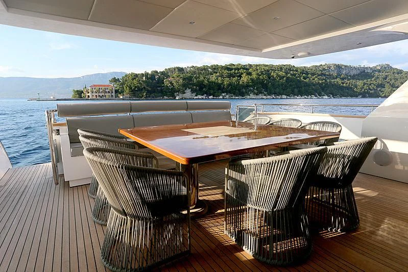a table and chairs on a deck aboard PRINCESS LONA Yacht for Sale