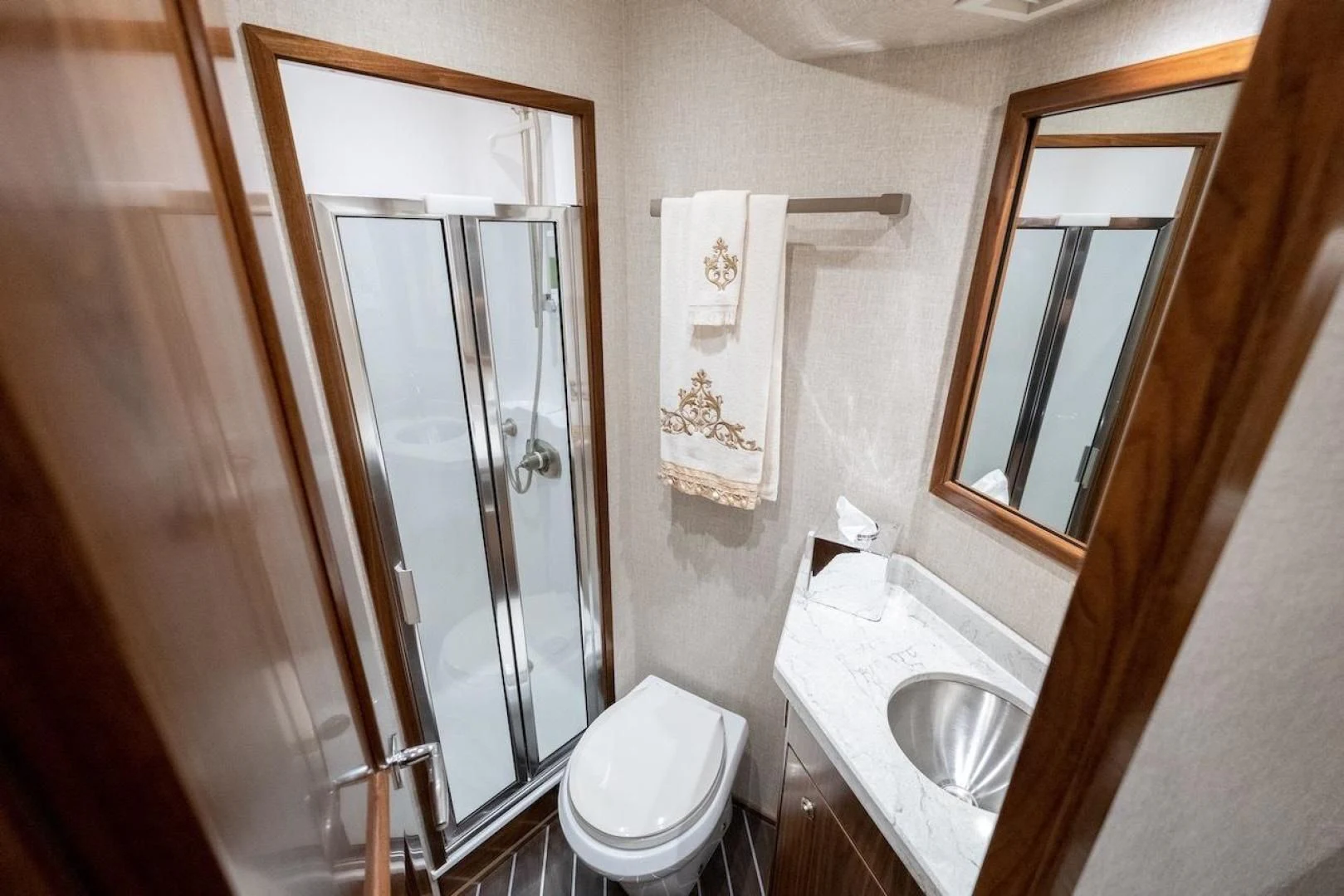 a bathroom with a glass shower aboard GAME ON Yacht for Sale