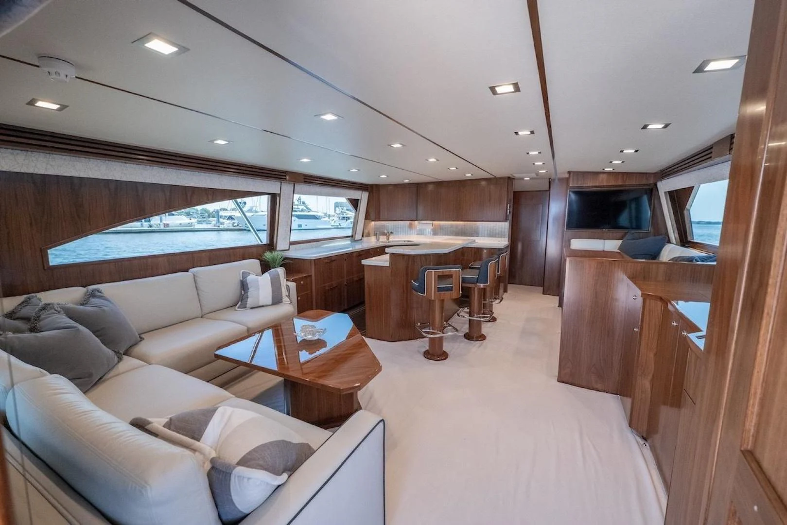 a living room with a couch and a table aboard GAME ON Yacht for Sale