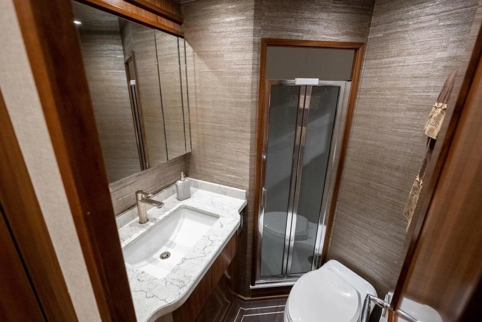 a bathroom with a sink and a mirror aboard GAME ON Yacht for Sale