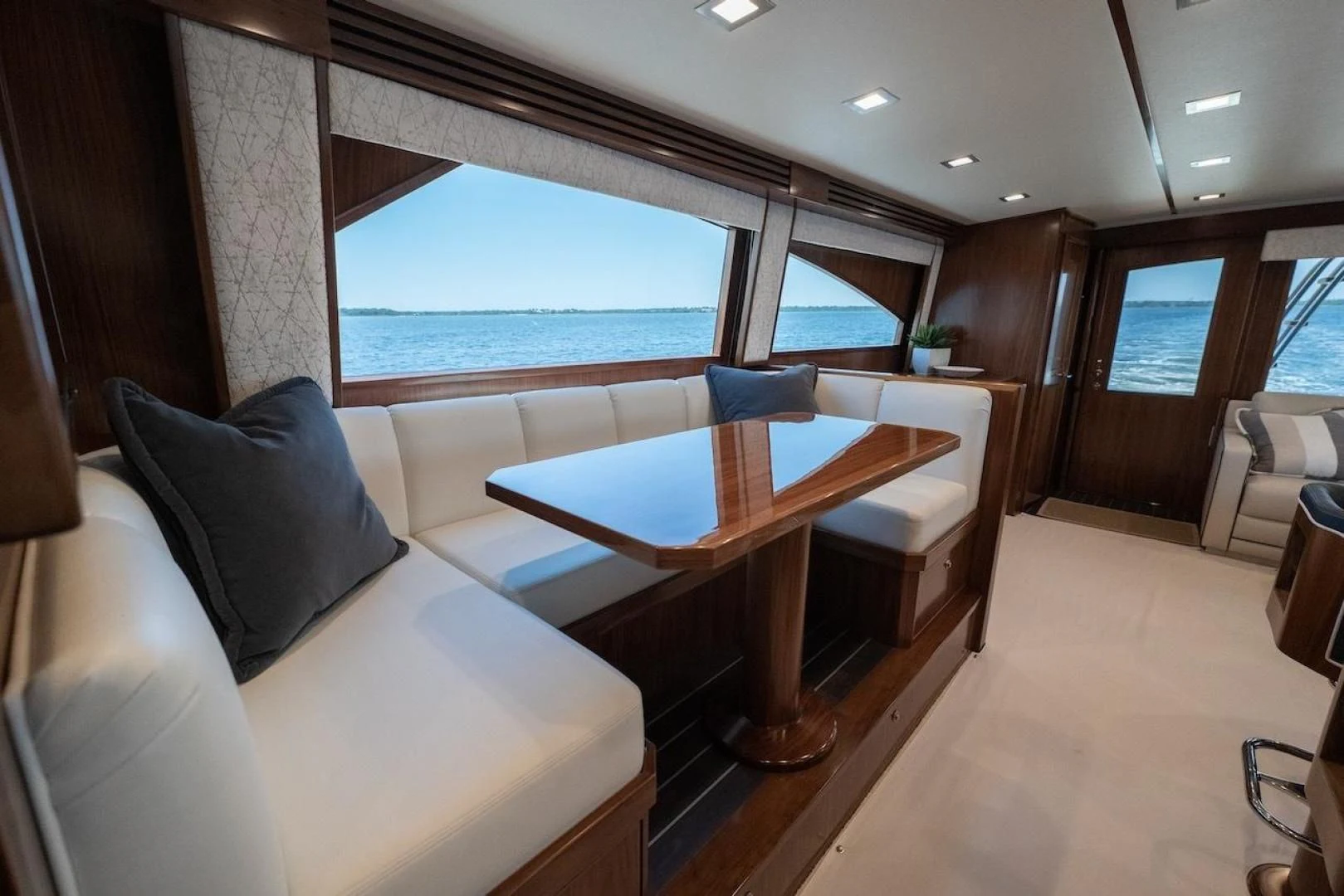 a room with a table and chairs aboard GAME ON Yacht for Sale