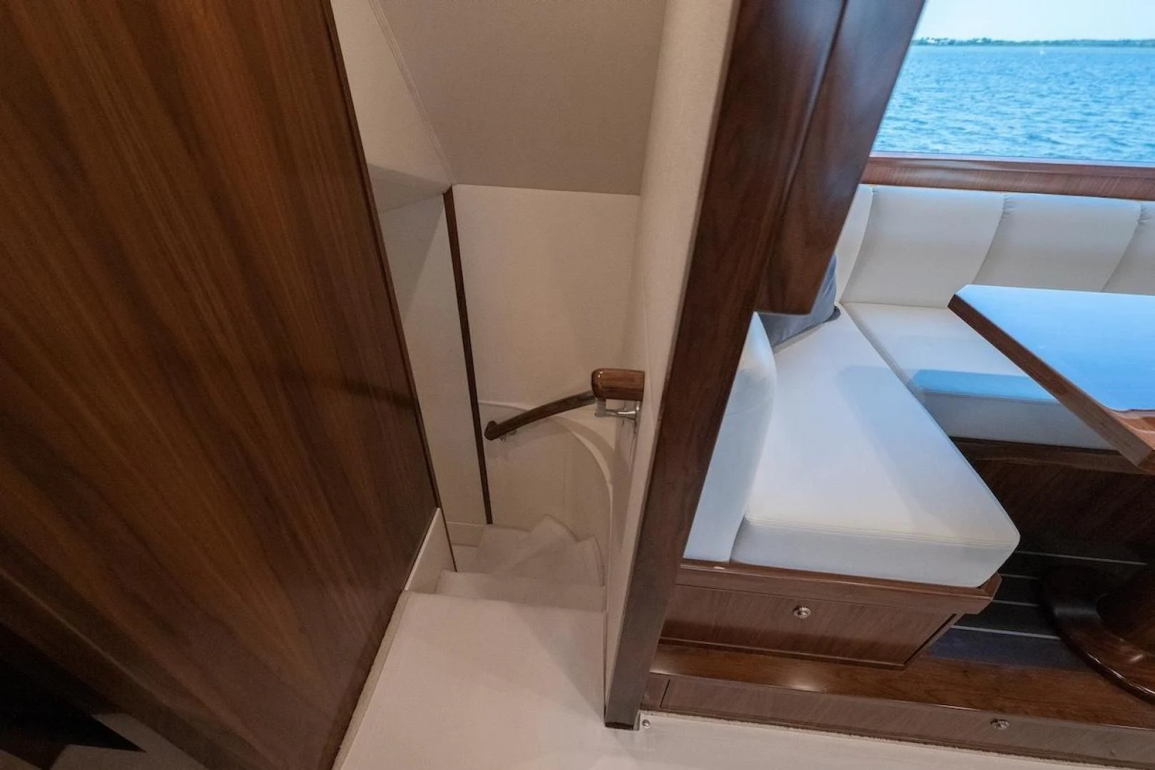 a wooden staircase with a railing aboard GAME ON Yacht for Sale