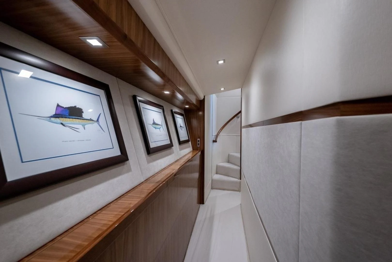 a room with a tv and a staircase aboard GAME ON Yacht for Sale